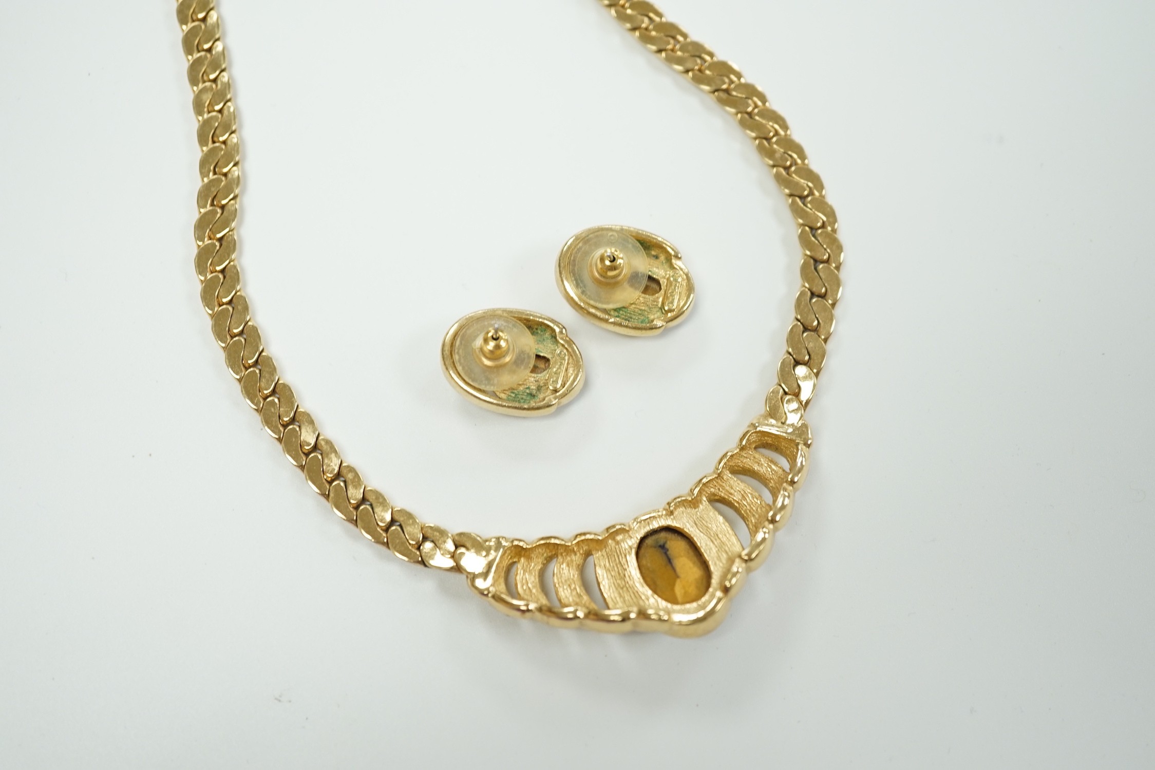 A Christian Dior gilt metal and two colour paste set costume necklace, 36cm and a pair of matching earrings.